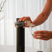 Pour oil into the bottle